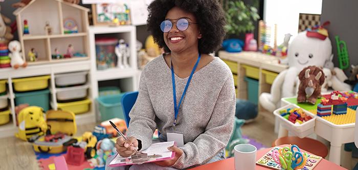 Reception teacher sitting in her classroom